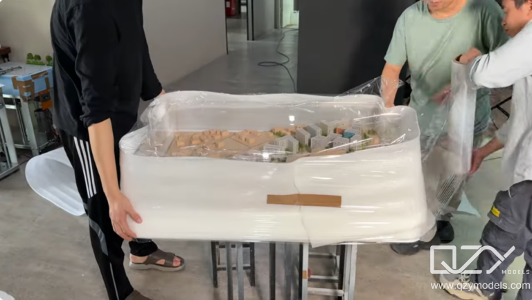 Protective Wrapping of Delicate Architectural Model Parts for Shipping Delicate architectural model components carefully wrapped and secured for safe shipping and transport protection