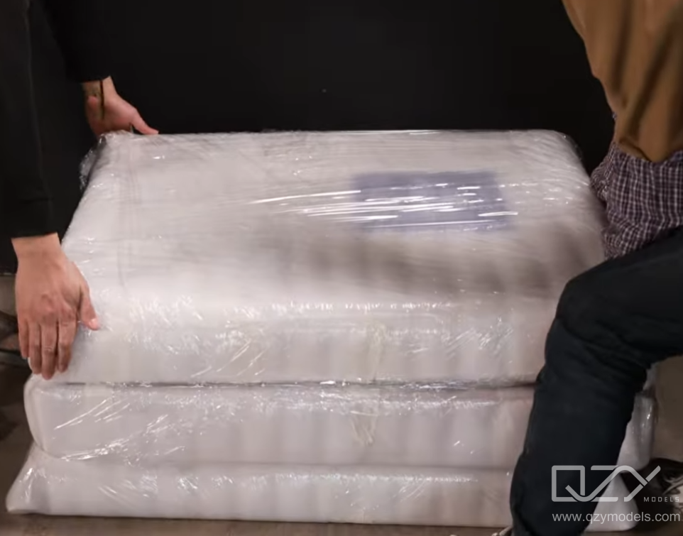 Protective Wrapping of Delicate Architectural Model Parts for Shipping Delicate architectural model components carefully wrapped and secured for safe shipping and transport protection