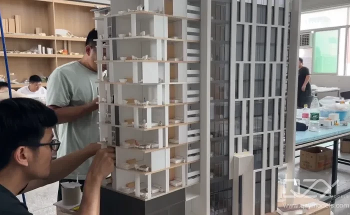 Architectural Model Maker Crafting Residential Scale Model