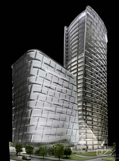 Architectural scale model of a high-rise tower with surrounding cityscape context
