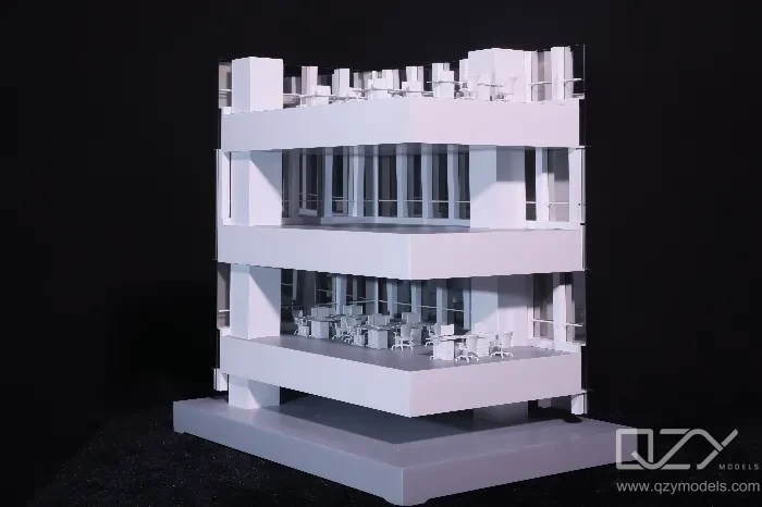 Cross-section scale model showing vertical mixed-use development with retail, amenity and residential floors