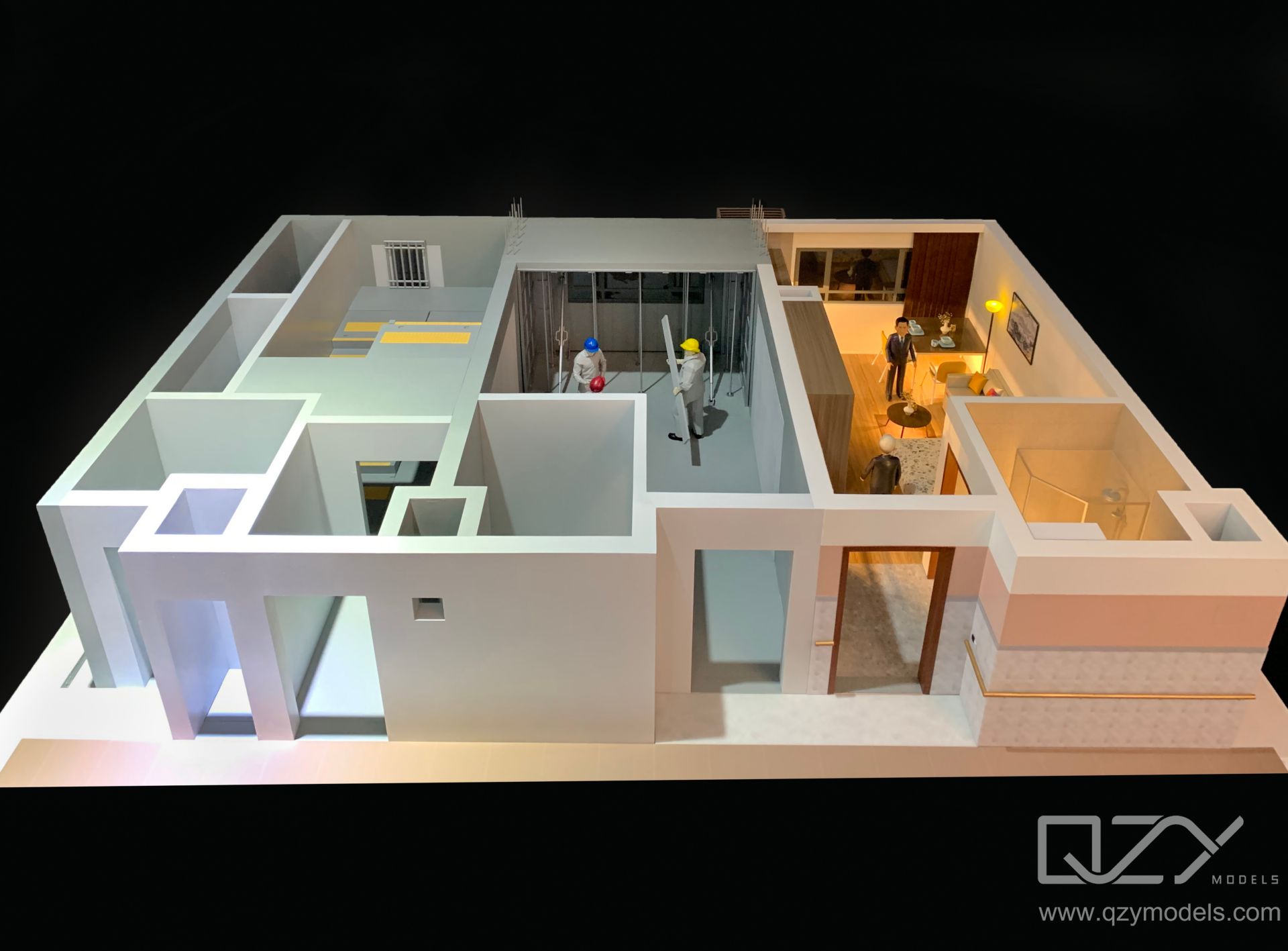 Removable roof Removable floor section revealing apartment layouts inside a residential sales suite model.