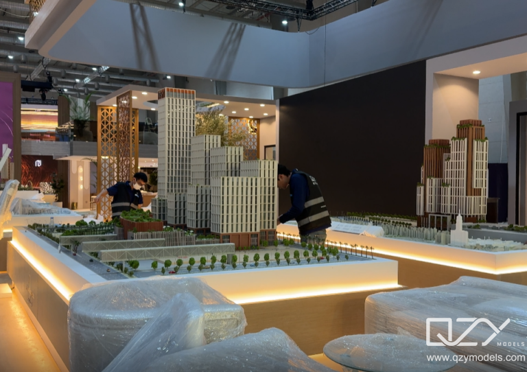 Preparing for Cityscape Large illuminated exhibition scale model displayed at a GCC property exhibition.
