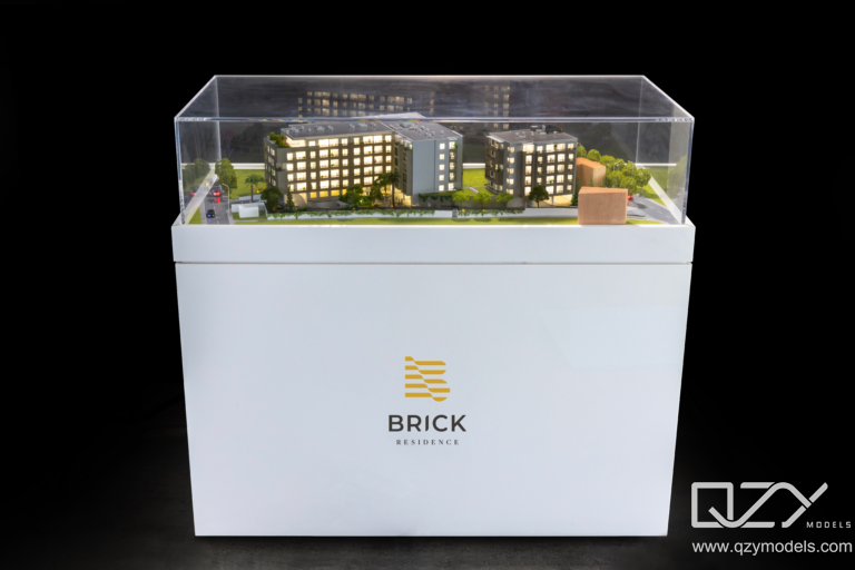 Architectural scale model inside protective acrylic display case. Museum-quality architectural model protected by a custom UV-filtered acrylic display case.