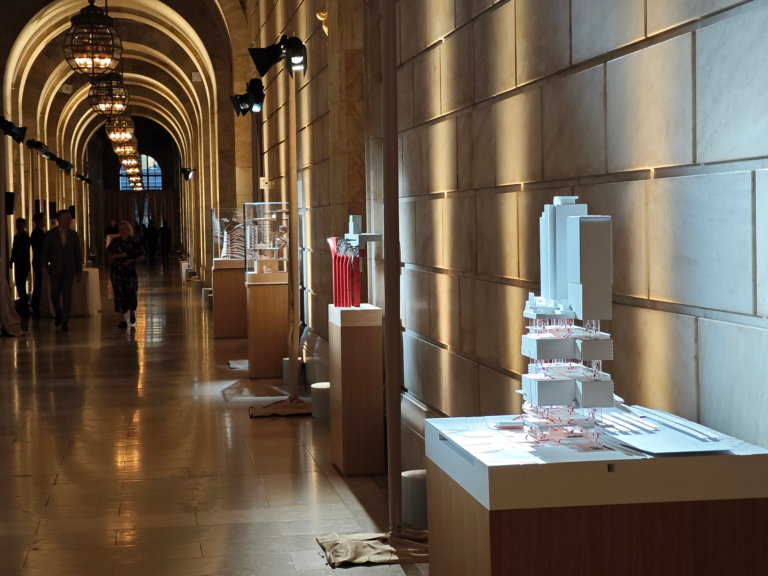 Model displayed in Gallery hall. Visitors viewing architectural models during KPF exhibition.
