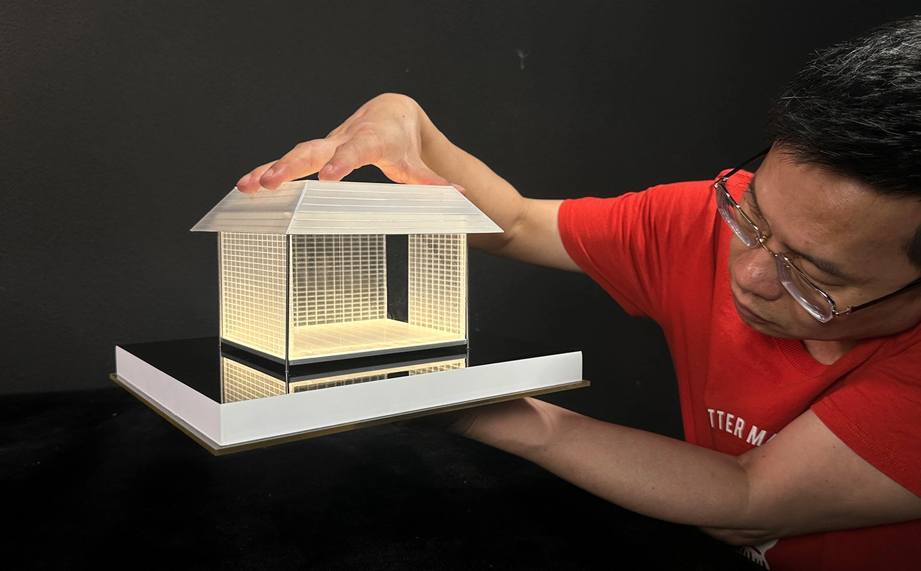 QZY Models specialist inspecting a custom architectural model for project requirements