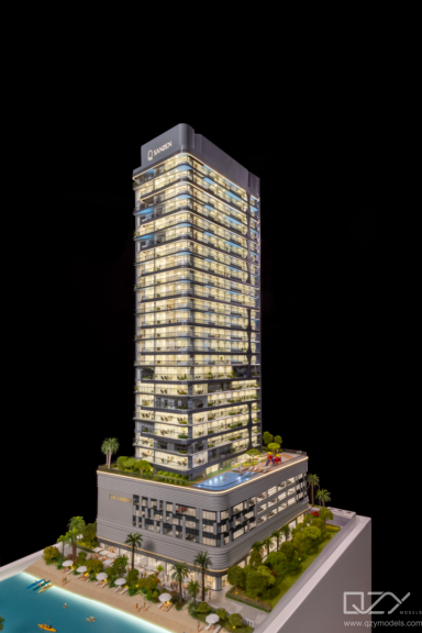 Luxury property sales gallery model Luxury real estate sales gallery featuring an interactive illuminated masterplan model as the centrepiece of the investor experience.
